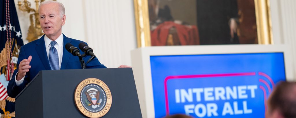Biden speaking at podium at Internet for All event